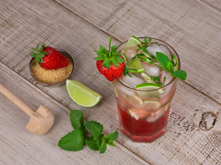Strawberry mojito cocktail over wooden backgroundの写真素材