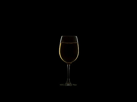Glass of wine isolated on a black backgroundの写真素材