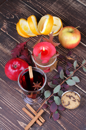 Mulled wine and spices on wooden backgroundの写真素材