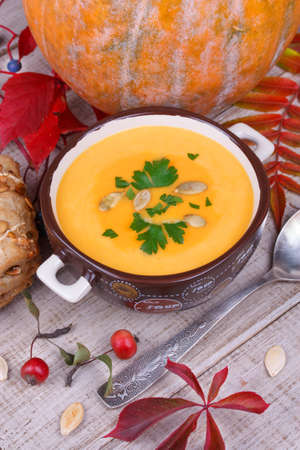Fresh cooked pumpkin soup with smoked chicken breastの写真素材