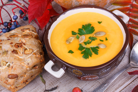 Fresh cooked pumpkin soup with smoked chicken breastの写真素材