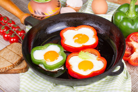 Eggs fried in a pepperの写真素材