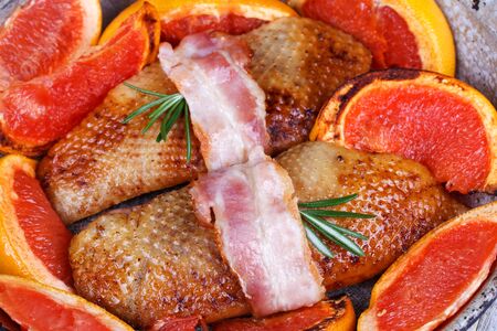 Roasted duck breast fillet with bacon and grapefruitの写真素材