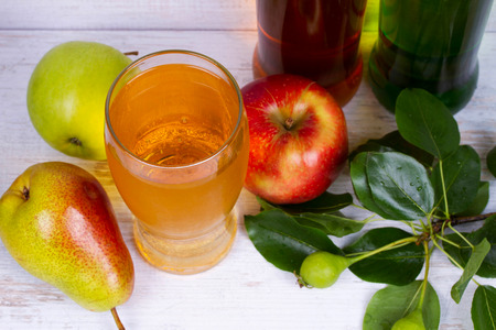 Glass and bottles of cider