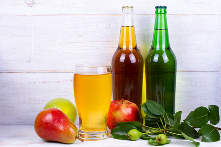 Glass and bottles of cider