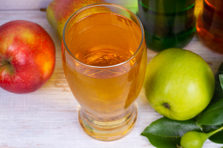 Glass and bottles of ciderの写真素材