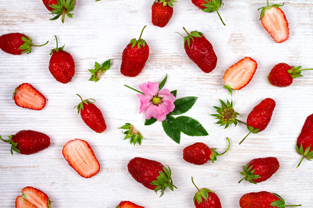 Sweet red strawberries on old white table, view from above, studio shotの写真素材