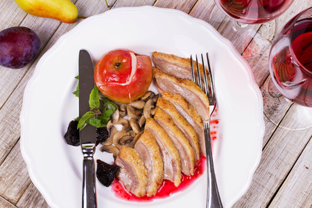 Roasted Duck Breasts with Mushroom, Apple and Plums Stuffing in Red Wine Sauseの写真素材