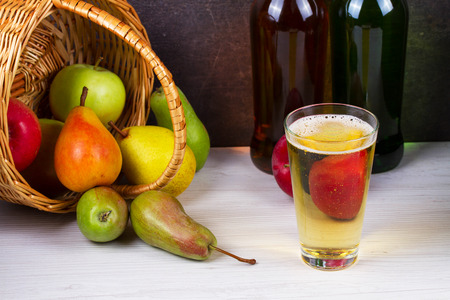 Glass and bottles of cider. Apples and pearsの写真素材