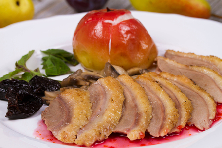 Roasted Duck Breasts with Mushroom, Apple and Plums Stuffing in Red Wine Sauseの写真素材