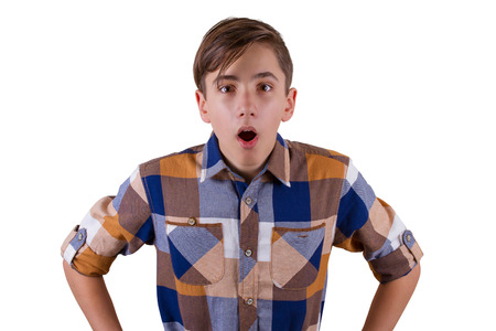 Surprised teenager, isolated on white backgroundの写真素材