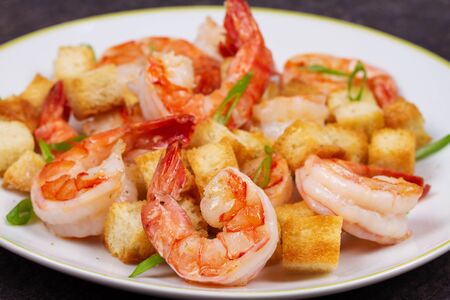 Shrimp with crispy croutons and scallions.の写真素材