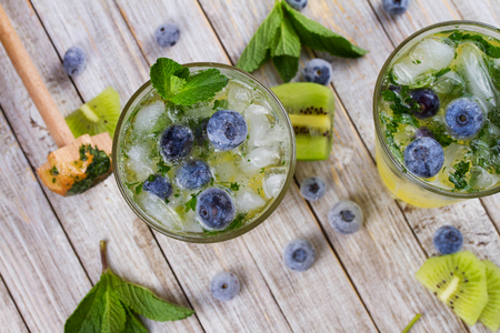 Kiwi and blueberry mojito. View from above, top studio shotの写真素材