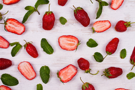Strawberries on white wooden background. View from above, top studio shotの写真素材