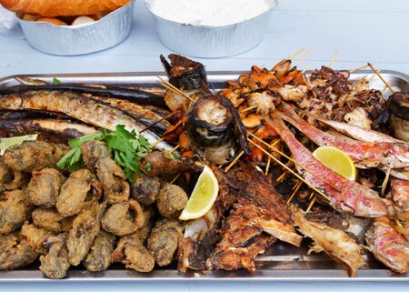 Grilled fish, shrimp, mussels and seafood sticks. Street foodの写真素材