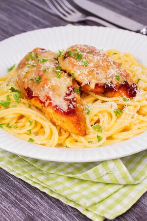 Chicken parmesan and pasta. Chicken breasts and spaghettiの写真素材