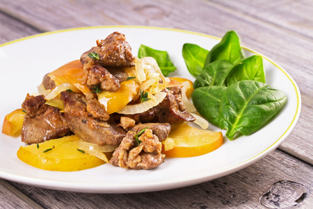 Chicken liver with apple, spinach and onionの写真素材