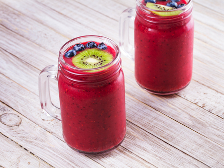 Berry kiwi smoothie in the jarsの写真素材