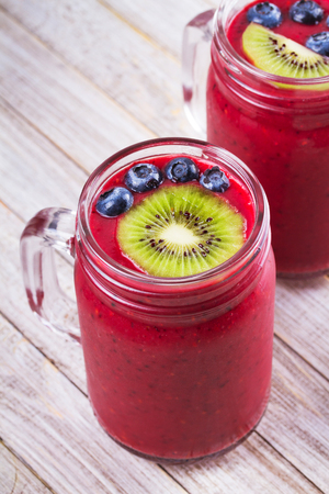 Berry kiwi smoothie in the jarsの写真素材