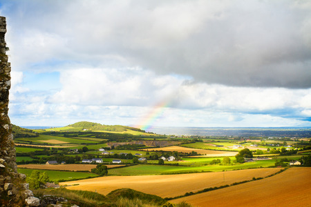 Countryside landscape with meadow and sky. Hay bales or straw on agricultural fields. Rural nature in the farm land. Wheat harvest, grain crop, harvestingの写真素材