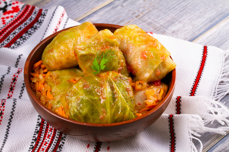 Stuffed cabbage leaves with meat. Cabbage rolls with meat, rice and vegetables. Dolma, sarma, sarmale, golubtsy or golabki, horizontalの写真素材