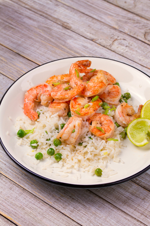 Shrimps with rice and peas.の写真素材