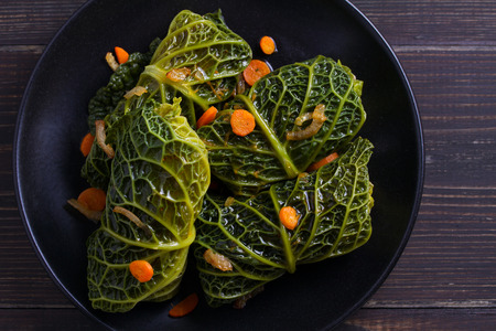 Savoy cabbage rolls with meat, rice and vegetables. Stuffed savoy cabbage leaves with meat. Chou...