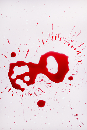 Wine splashes, splatters and drops. Texture background for design. Spot of red wine on white backgroundの写真素材