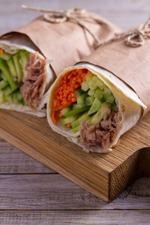 Tuna wraps. Wraps with tuna fish, cucumber, avocado and carrot. Homemade tasty burritoの写真素材