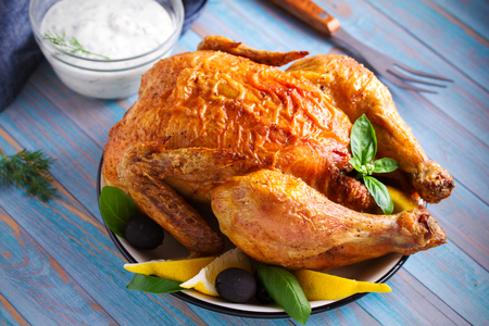 Chicken with yogurt sauce on blue wooden background. horizontalの写真素材