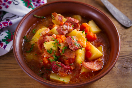 Delisious homemade stew. Goulash soup in a bowl on wooden table. horizontalの写真素材