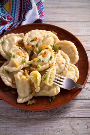 Dumplings, filled with potato. Dumplings with filling. verticalの写真素材