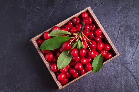 Fresh cherries on black background. Fresh ripe sweet cherries