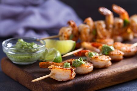 Cilantro lime grilled shrimps. Shrimps on skewers with garlic butter sauceの写真素材