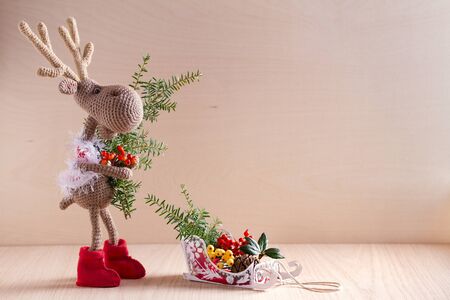 Christmas and New Year background with toy deer. Winter season holidays decorations. Copy space の写真素材