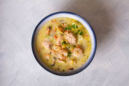 Seafood chowder with salmon, shrimps, crabmeat and mussels. View from above, top viewの写真素材