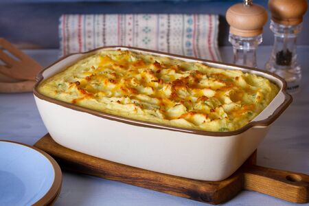 Creamy fish pie: salmon, cod, smoked coley, creamy sauce and cheesy potato toppingの写真素材