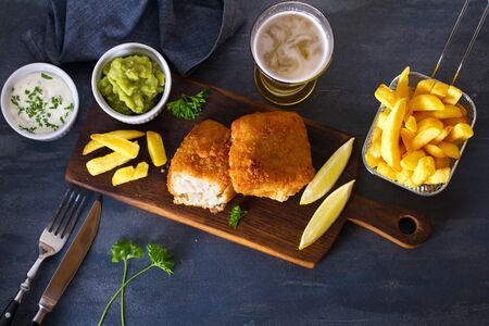 Traditional fish and chips with mushy peas and glass of beer. View from above, top viewの写真素材