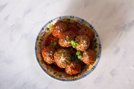 Meatballs in bowl on white background. View from above, top viewの写真素材