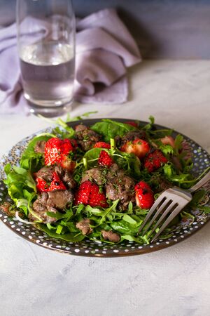 Chicken liver salad with strawberriesの写真素材
