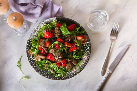 Chicken liver salad with strawberries. View from above, top viewの写真素材