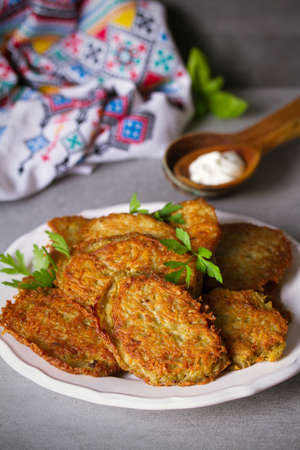 Potato cakes. Vegetable fritters, pancakes, latkes - dish consisting of pan fried shredded potatoes.の写真素材