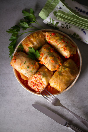 Cabbage rolls with meat, rice and vegetables. Chou farci, dolma, sarma, golubtsi or golabki. Flat lay, layout, overheadの写真素材