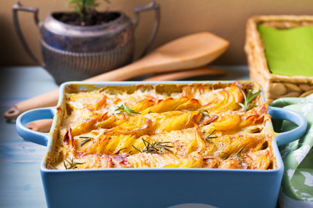 Tender creamy potato gratin. Scalloped potatoes or potato bakeの写真素材