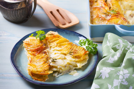Tender creamy potato gratin with rosemary. Scalloped potatoes or potato bakeの写真素材