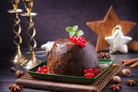 Fruit cake pudding traditionally served as part of Christmas dinner. High angle view with copy spaceの写真素材