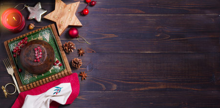 Fruit cake pudding traditionally served as part of Christmas dinner. High angle view with copy spaceの写真素材