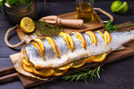 Roasted salmon with lemon, oranges and herbsの写真素材