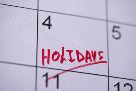 Holidays marked on a calendarの写真素材