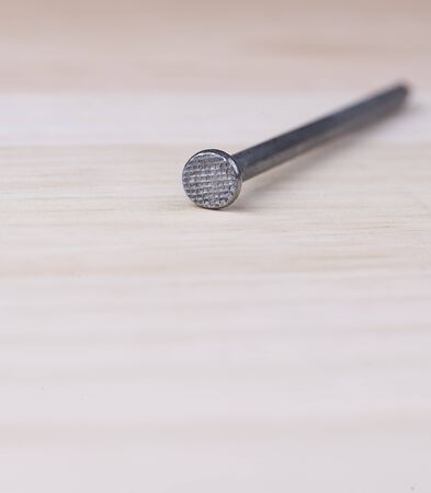 Nail on woodの写真素材